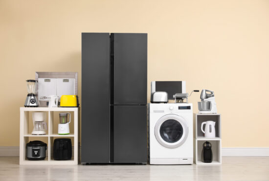 Modern,Refrigerator,And,Other,Household,Appliances,Near,Beige,Wall,Indoors